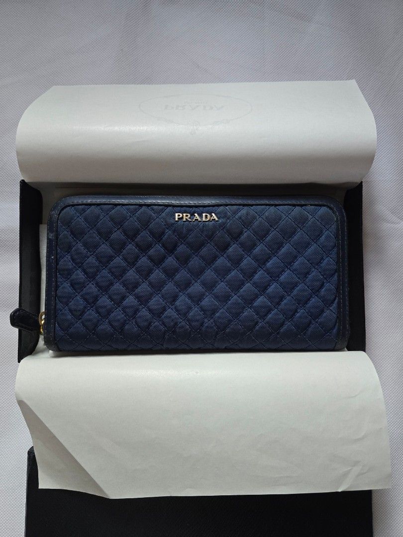 Prada Blue Quilted Nylon Tessuto Wallet (Category: Luxury Bags & Wallets) located in Manila. Submitted by buyn5ell (Listing ID 1376829619, Image 2). Description: Authentic from Europe 4.5 in. x 8 in. Complete with packaging and authenticity card Flaws shown in photos such as scuffs etc..