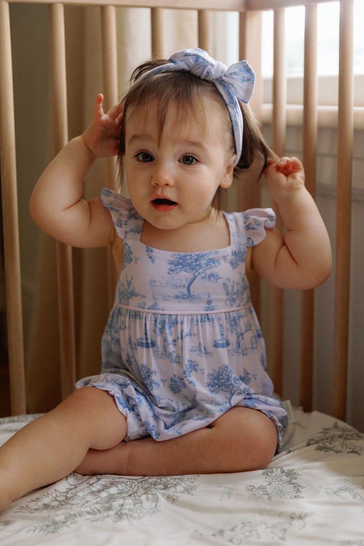House of Holly - ruffle bubble romper – garden toile (baby blue) (Category: Babies & Kids Fashion) located in Singapore. Submitted by cry6a6y (Listing ID 1376971091, Image 1). Description: Adorable baby girl romper with a matching headband. Features a beautiful blue and white toile print. Perfect for a special occasion or everyday wear. The romper has a comfortable fit and is made of soft, breathable fabric..