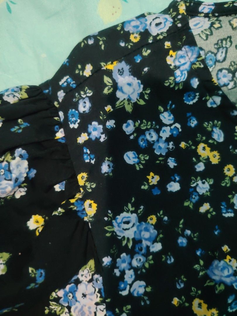 Stradivarius Midnight Garden Dress (Category: Dresses) located in Panabo. Submitted by prettythriftedthings (Listing ID 1377005633, Image 3). Description: Turn heads in this charming black floral dress by Stradivarius! Featuring delicate blue and yellow blooms, puff sleeves, and a relaxed, tiered silhouette, this dress is perfect for a breezy day out or a casual date night. Made with soft, flowy fabric that is comfy, stylish, and easy to wear..