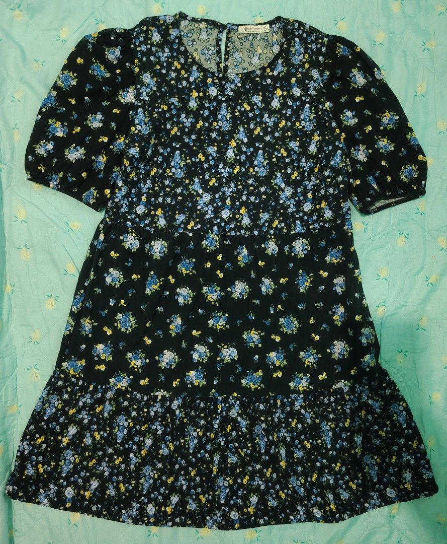Stradivarius Midnight Garden Dress (Category: Dresses) located in Panabo. Submitted by prettythriftedthings (Listing ID 1377005633, Image 1). Description: Turn heads in this charming black floral dress by Stradivarius! Featuring delicate blue and yellow blooms, puff sleeves, and a relaxed, tiered silhouette, this dress is perfect for a breezy day out or a casual date night. Made with soft, flowy fabric that is comfy, stylish, and easy to wear..