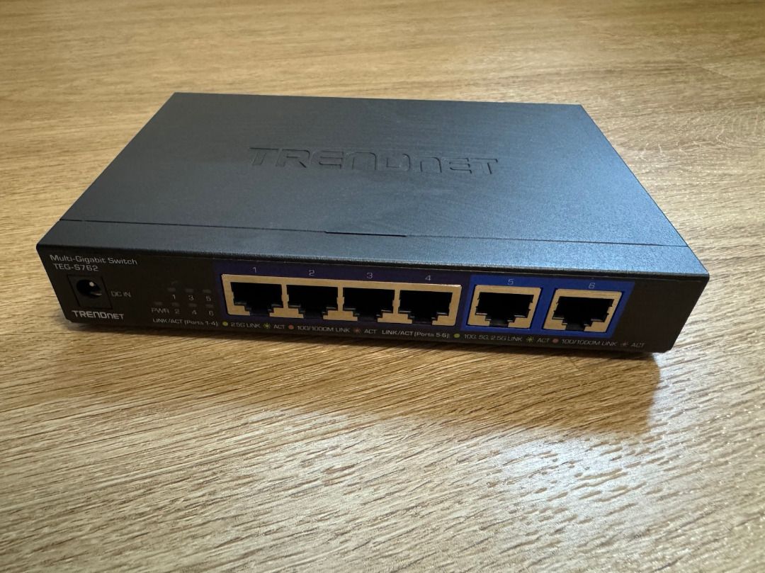 TRENDnet 6-Port 10G Switch 4x2.5G 2x10G RJ-45 Ports TEG-S762 (Category: Networking) located in Singapore. Submitted by airpay (Listing ID 1376852958, Image 1). Description: Condition very good. Comes with original power adapter - DEVICE INTERFACE: 4 x 2.5G RJ-45 ports; 2 x 10G RJ-45 ports. - 10G PORTS: This 6-Port 10G switch offers two 10G ports for high-speed network connections providing a cost-effective solution in adding 10G link capability. 