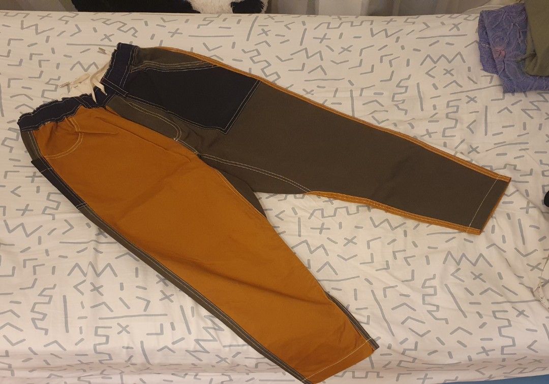 Two-Tone Patchwork Pants (Category: Other Bottoms) located in Singapore. Submitted by purplepars (Listing ID 1376966575, Image 1). Description: Two-tone design with unique patchwork. Elastic waistband 76cm unstretched. Bought in HK but too small for me so never worn. Meetup at Newton or at my convi.