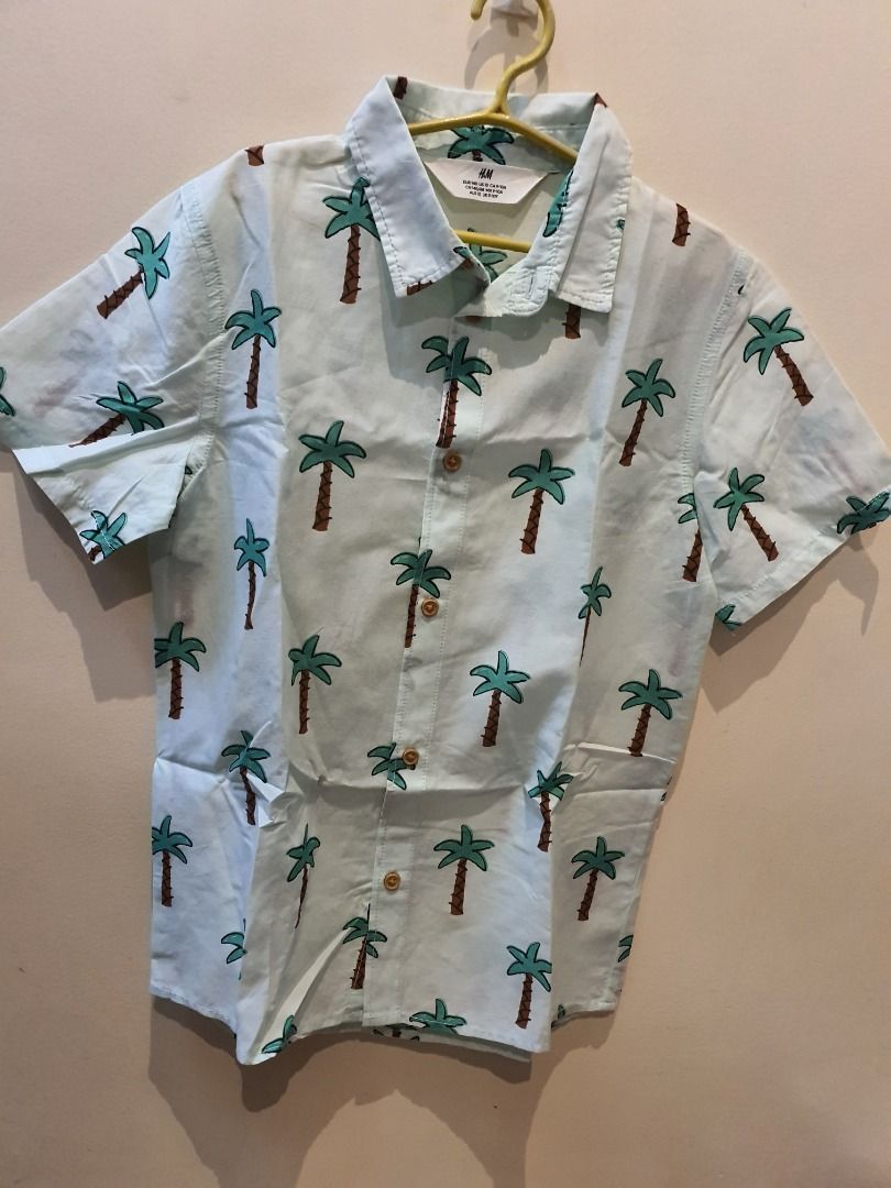 Hawaiian Inspired Polo Shirt (Category: Babies & Kids Fashion) located in Caloocan City. Submitted by forever_growing (Listing ID 1377140575, Image 1). Description: Lightly used t-shirt polo Brand: H&M Polo Size: 140 .