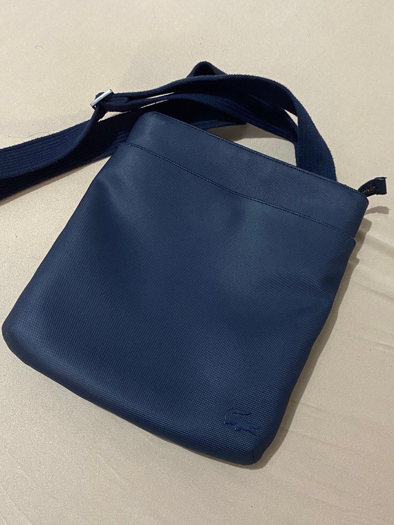 Authentic Lacoste Messenger Bag (Category: Sling Bags) located in Navotas City. Submitted by jaldeclutters (Listing ID 1377138917, Image 1). Description: minimal flaws (see photos).