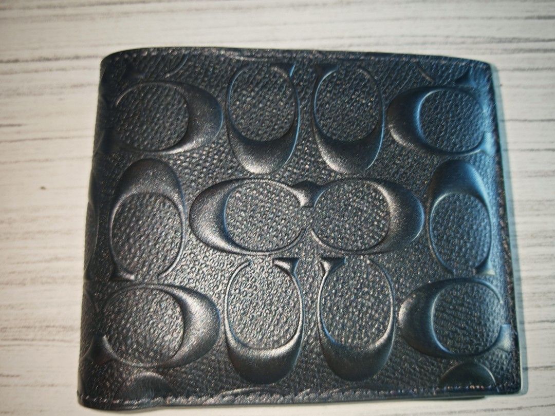 ORIGINAL AUTHENTIC Coach Men's Bi-Fold Wallet (Category: Bags & Wallets) located in Singapore. Submitted by genuineshoppes_9 (Listing ID 1377051099, Image 1). Description: - Coach men's bi-fold wallet - Features multiple card slots - Includes a bill compartment - Made with high-quality leather - Signature Coach pattern I've an extra wallet but not using, so thought of selling it. Comes together in 2. Original tag removed. Can inspect upon payment