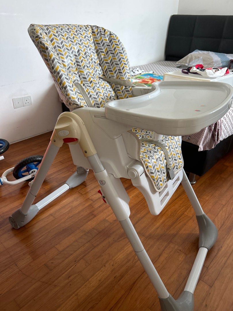 Fisher-Price High Chair with Chevron Pattern (Category: Baby High Chairs) located in Singapore. Submitted by mayank.prksh (Listing ID 1377039126, Image 3). Description: This Fisher-Price high chair is a great option for your little one! It features a stylish chevron pattern on the seat and backrest. The tray is removable and easy to clean, and the chair has a safety harness to keep your baby secure. It's in good condition, with some signs of use 