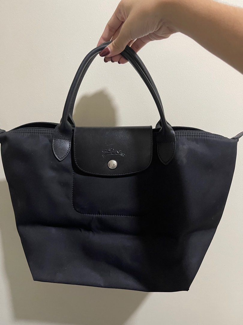 Longchamp Medium Short handle (Category: Shoulder Bags) located in Taguig. Submitted by ky_declutterss (Listing ID 1377143698, Image 1). Description: FOR SALE: Longchamp MSH Black - Original - In good condition, just a small white stain (please swipe through the photos) - SLIGHTLY NEGOTIABLE. Will ignore lowballers. RFS: i dont use it anymore MOP: BDO/GCASH MOD: Lalamove/GGX.