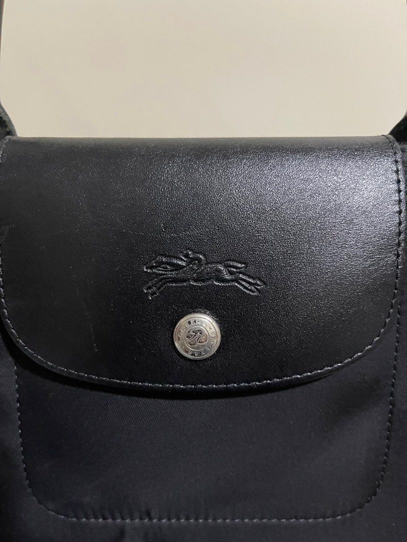 Longchamp Medium Short handle (Category: Shoulder Bags) located in Taguig. Submitted by ky_declutterss (Listing ID 1377143698, Image 2). Description: FOR SALE: Longchamp MSH Black - Original - In good condition, just a small white stain (please swipe through the photos) - SLIGHTLY NEGOTIABLE. Will ignore lowballers. RFS: i dont use it anymore MOP: BDO/GCASH MOD: Lalamove/GGX.