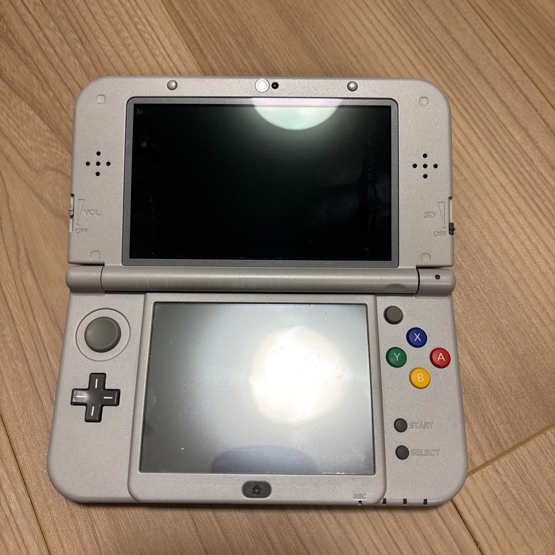 Nintendo 3DS LL Super Famicom Edition (Category: Nintendo) located in Manila. Submitted by japan_treasure (Listing ID 1377081498, Image 2). Description: This is the Super Famicom model of the 3DS LL. I put the cover on and used it a few times. There is one small scratch on the part exposed from the cover, and several other scratches that inevitably occur when opening and closing. Contents: Main unit, AC adapter No box. I will include a few softwa