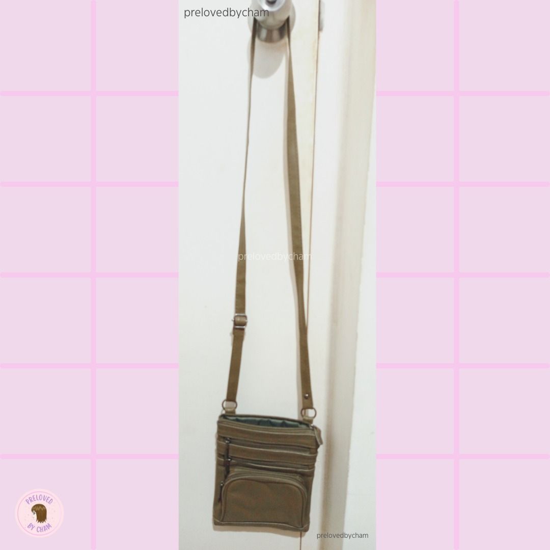 Olive color Crossbody Bag (Category: Cross-body Bags) located in Calamba. Submitted by prelovedbycham (Listing ID 1377138958, Image 3). Description: - still in good condition - faux leather - with zippers (see pic) Strap: 32" Bag Size: 6.5"X 8.5" *Shipping Fee is shouldered by the buyer WILL NOT ENTERTAIN: -People who haggle too much (note that price is fixed) and ask for too much personal info. Only SURE buyers, please! -Individuals with dummy a