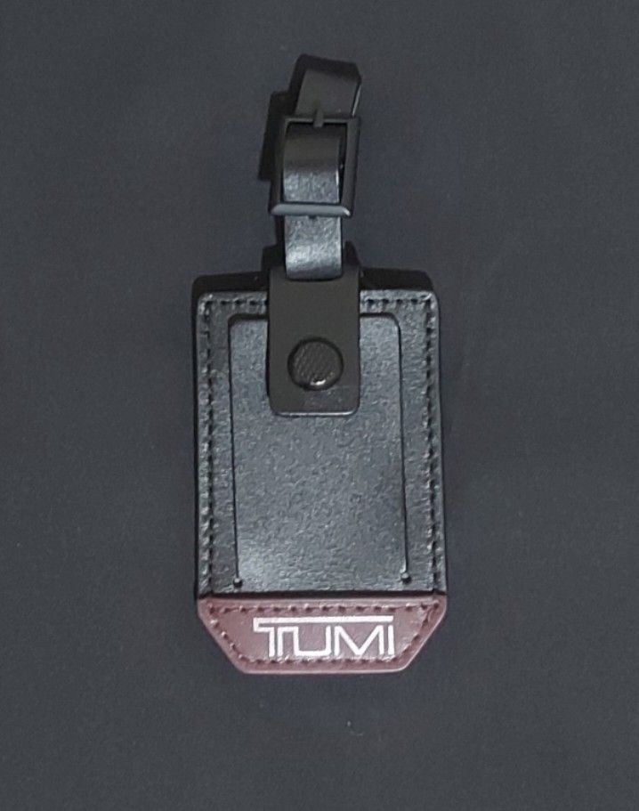 Original TUMI Leather Black/Burgundy Bag Tag (Category: Luxury Accessories) located in Pasay City. Submitted by itemsforsale00 (Listing ID 1376805667, Image 1). Description: .