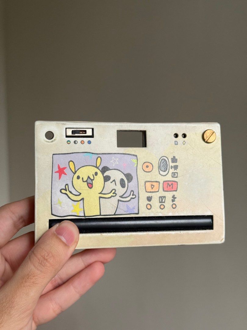 Papershoot - Digital Film Camera (Category: Cameras) located in Manila. Submitted by luckyluna01234 (Listing ID 1374260072, Image 2). Description: 📸 Paper Shoot Camera – Used but Fully Working • Bought October 2023 • Still works great • Has some dents and a missing screw (cosmetic only - does not affect function. Original unit has replacement plastic screws) • No SD card included (not part of the original package) • Reason for selling: haven’t u