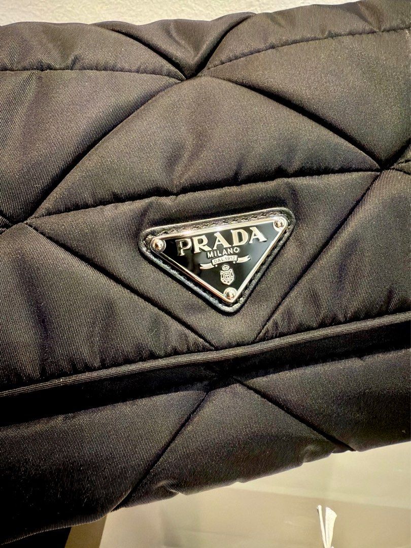 PRADA Padded Re-Nylon Bag (Category: Luxury Bags & Wallets) located in Paranaque City. Submitted by robear26 (Listing ID 1377052841, Image 3). Description: 🔵 Rank SA/Like new condition 🔵 Comes complete (two dust bag, care booklet, receipt and paper bag) .