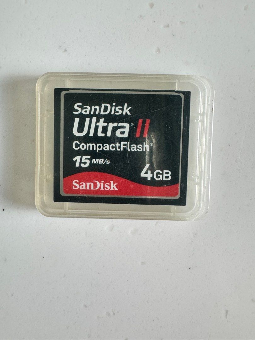 SanDisk Ultra II CompactFlash 4GB (Category: Hard Disks & Thumbdrives) located in Singapore. Submitted by botannia (Listing ID 1377036142, Image 1). Description: SanDisk Ultra II CompactFlash card. 4GB capacity with 15MB/s transfer speed. Comes with a protective case. Perfect for older cameras or devices that use CompactFlash cards. Tested and working..