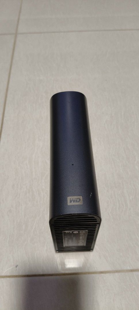 WD My Book Live External Hard Drive (Category: Hard Disks & Thumbdrives) located in Singapore. Submitted by benkhor26756 (Listing ID 1377127260, Image 1). Description: - WD My Book external hard drive - Sleek, dark blue design - Perfect for storing photos, videos, and documents - In good condition - Ready to use - Includes hard drive.