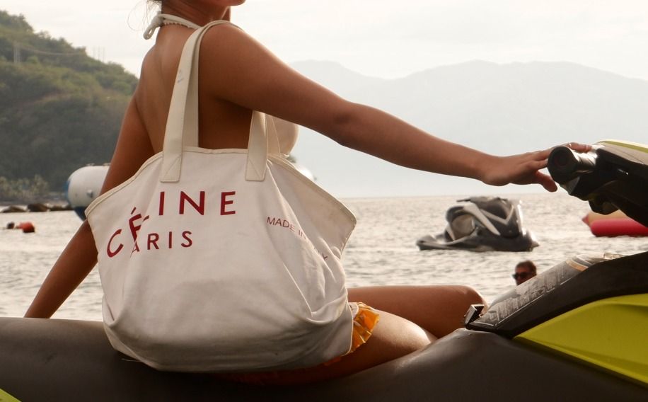 CELINE Paris Canvas Tote Bag (Category: Luxury Bags & Wallets) located in Santiago. Submitted by impatientpolka (Listing ID 1377228349, Image 2). Description: Used Once for Beach Trip Super nice cloth bag Like New COMES WITH CELINE POUCH INSIDE Sold at other secondhand sites for 1000dollars plus! selling for low *Has minimal pen mark last 3 photos for reference only but first 5 photos r actual pics.