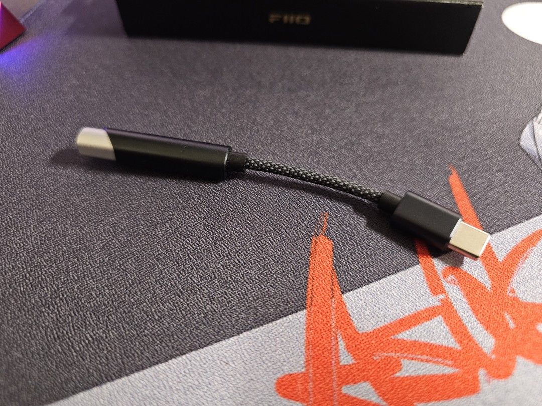 FiiO KA11 USB C DAC AMP Black (Category: Portable Audio Accessories) located in Singapore. Submitted by tnhwei (Listing ID 1377340806, Image 2). Description: Like new FiiO KA11 USB C DAC Headphone/Earphone Amplifier. No scratches and scuffs as I have never brought it outside. Comes with original box. This is a compact and portable but very powerful amp that can drive hard to drive headphones. It can enhance audio quality for your headphones or ie