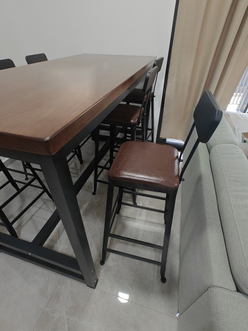 Table with Stools (Category: Tables & Sets) located in Singapore. Submitted by 266jt (Listing ID 1377224580, Image 3). Description: - brought 2 sets and too big for my house. as good as new - each consist of 1 table and 6 tall stools - Stylish bar table set - Sturdy black metal frame - Warm wooden tabletop - Matching bar stools with comfortable brown seats - Dimensions: 1.7m (L) x 0.8m (W) x 1.4m (H).