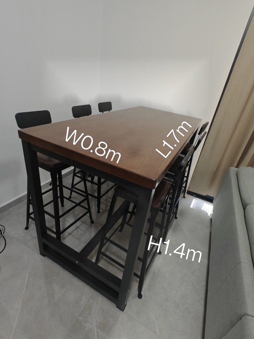 Table with Stools (Category: Tables & Sets) located in Singapore. Submitted by 266jt (Listing ID 1377224580, Image 1). Description: - brought 2 sets and too big for my house. as good as new - each consist of 1 table and 6 tall stools - Stylish bar table set - Sturdy black metal frame - Warm wooden tabletop - Matching bar stools with comfortable brown seats - Dimensions: 1.7m (L) x 0.8m (W) x 1.4m (H).