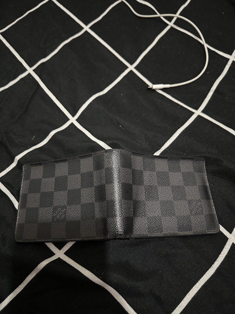 Louis Vuitton Graphite bifold wallet (Category: Luxury Bags & Wallets) located in Quezon City. Submitted by travisdiemon (Listing ID 1377345242, Image 3). Description: Authentic Condition 8.5/10 Sign of usage Very presentable.