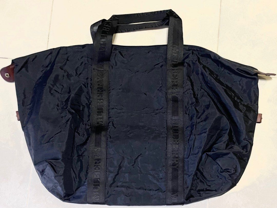 Mulberry Vintage XL Travel Duffle Bag - Black (Category: Bags & Wallets) located in Singapore. Submitted by clamtypes (Listing ID 1377299418, Image 2). Description: Size: 69cm x47cm when unfolded Travel bag that folds into a 35x27cm zippered pouch. Features a spacious interior and a separate pouch. Includes leather accents and the iconic Mulberry logo. Selling for cheap due to musky smell. Washed by professional bag cleaners already Smartpac deli