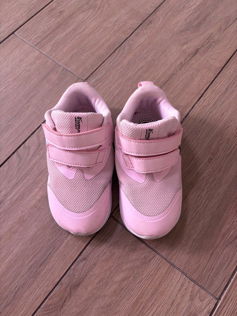 Nike Star Runner 3 Toddler Shoes - Pink (Category: Babies & Kids Fashion) located in Singapore. Submitted by kezshop (Listing ID 1377287455, Image 2). Description: Size: UK 7.5 EU: 25 These Nike Star Runner 3 toddler shoes are in good condition. They feature a pink mesh upper with black Nike swoosh logos. The shoes have velcro straps for easy on and off. The soles show some wear, but the shoes are still in great shape..