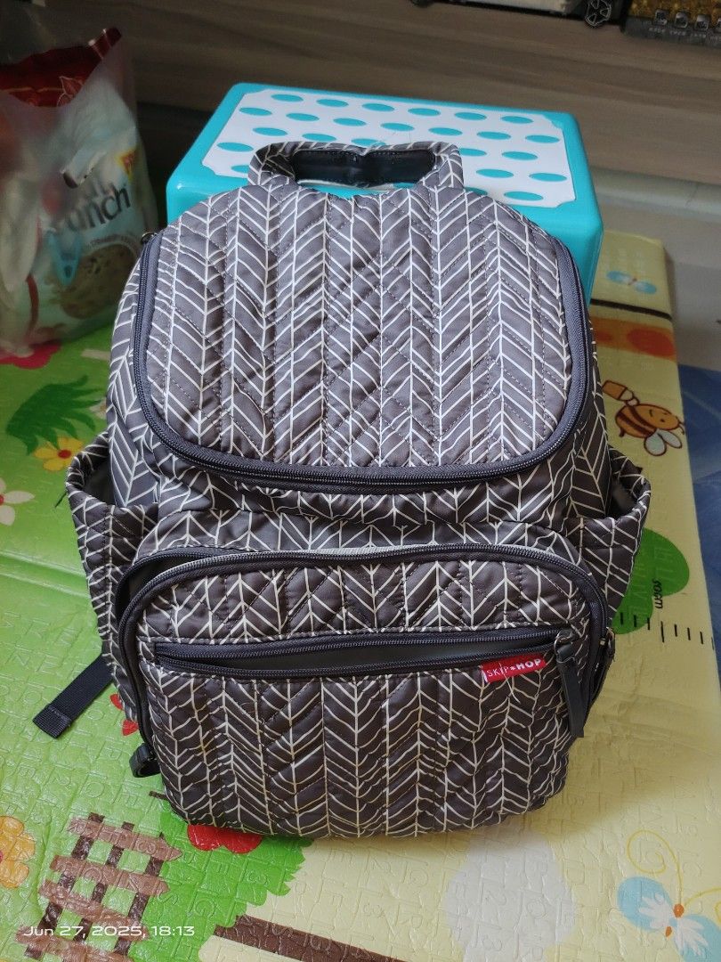 Skip Hop Diaper Backpack - Grey Chevron (Category: Diaper Bags & Wetbags) located in Singapore. Submitted by Boss_Baby (Listing ID 1377297835, Image 1). Description: - Skip Hop diaper backpack - Grey chevron pattern - Multiple compartments for organization - Adjustable straps for comfort - Good condition.