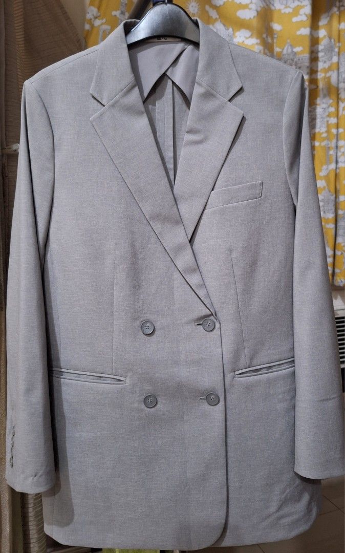Uniqlo Miracle Air Jacket (Category: Coats, Jackets and Outerwear) located in Makati City. Submitted by worn2work_treasures (Listing ID 1377291421, Image 3). Description: Double breasted Jacket..