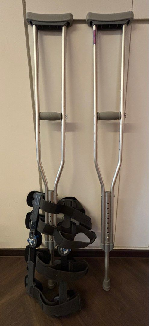 Adjustable Crutches with Knee Brace + AirCast Set (Category: Braces, Support & Protection) located in Singapore. Submitted by asymbiote (Listing ID 1377432658, Image 1). Description: Pending for prospective patients. Save on your medical bill. Items are 6 weeks old. Slight bend on one of the crutch. Aircast Set: Well Used items but still in perfect functioning condition. AI Description: This listing includes a pair of adjustable crutches and a kn