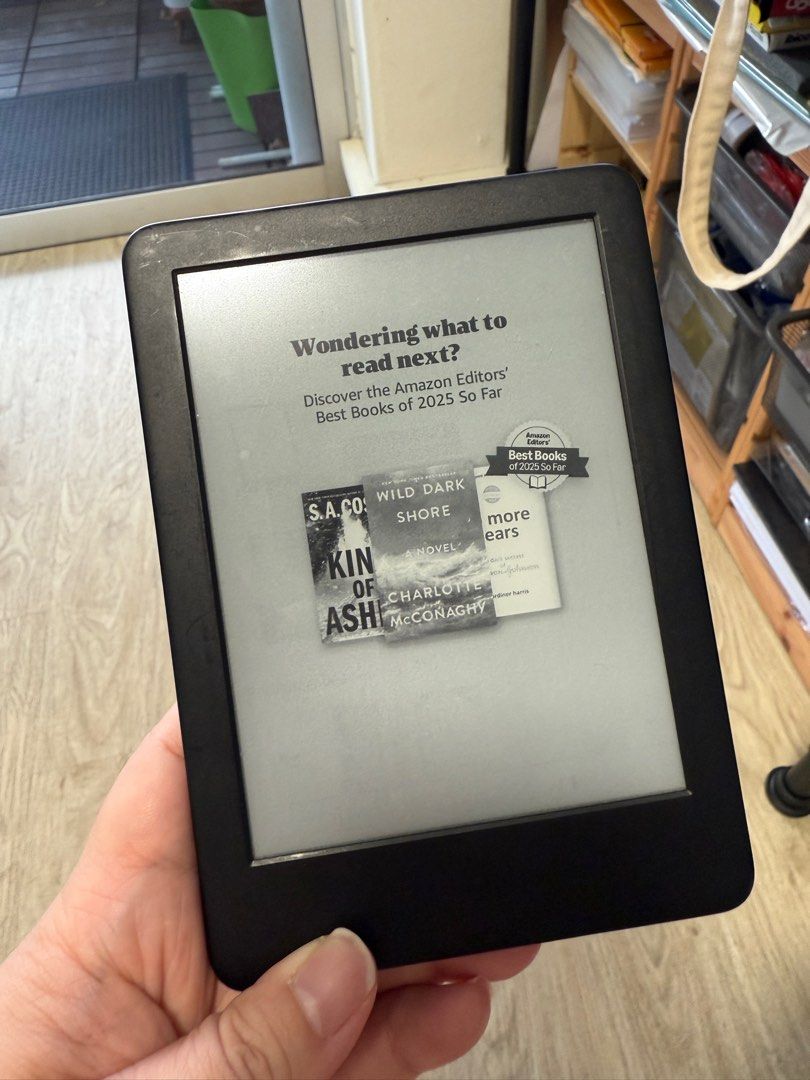 Amazon Kindle E-reader (Category: E-Readers) located in Singapore. Submitted by cangbello (Listing ID 1377528307, Image 1). Description: Used Amazon Kindle e-reader. Shows some signs of wear on the back. Screen is in good condition. Perfect for reading on the go. Comes with no accessories..
