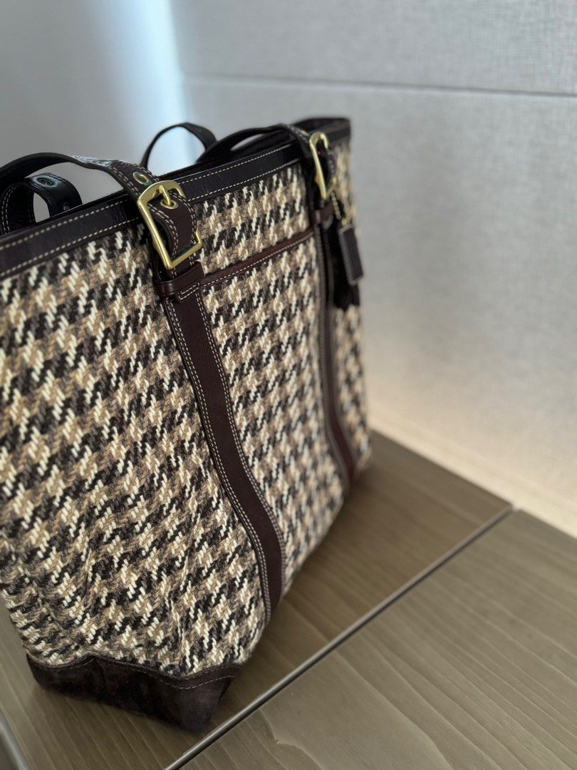 Beautiful Unique Coach Houndstooth Tote Bag (Category: Bags & Wallets) located in Singapore. Submitted by professionalism (Listing ID 1377440425, Image 2). Description: Beautiful and unique Coach tote bag in a classic houndstooth pattern. Features a spacious interior with a zip closure for safety and a practical interior pocket. The bag also features beautiful leather trim and handles with gold-toned hardware. Lightly used and in great condition,