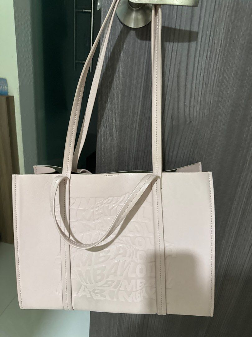 BIMBA Y LOLA Tote Bag - Light Pink (Category: Tote Bags) located in Singapore. Submitted by at4101 (Listing ID 1377434683, Image 1). Description: Stylish tote bag from BIMBA Y LOLA in a lovely light pink color. Features a unique embossed logo design. Perfect for everyday use. The bag has two handles and is in excellent condition..