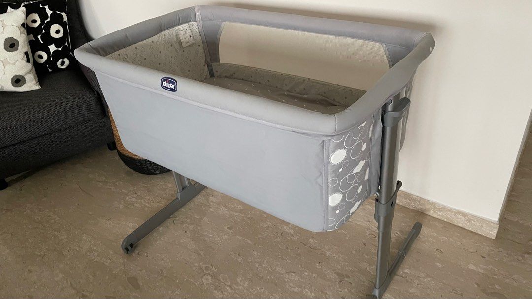 Chicco Next2Me Cot - Grey (Category: Cots & Cribs) located in Singapore. Submitted by whatusernametoput (Listing ID 1377433900, Image 1). Description: Chicco Next2Me bassinet in grey. Adjustable height and can be attached to the bed. Some stains are visible on the inner lining (see photos). You can literally just remove the fabric, wash the whole thing and the stains be gone . Otherwise in perfect functioning condition. NEGO FOR FAST DEALS .
