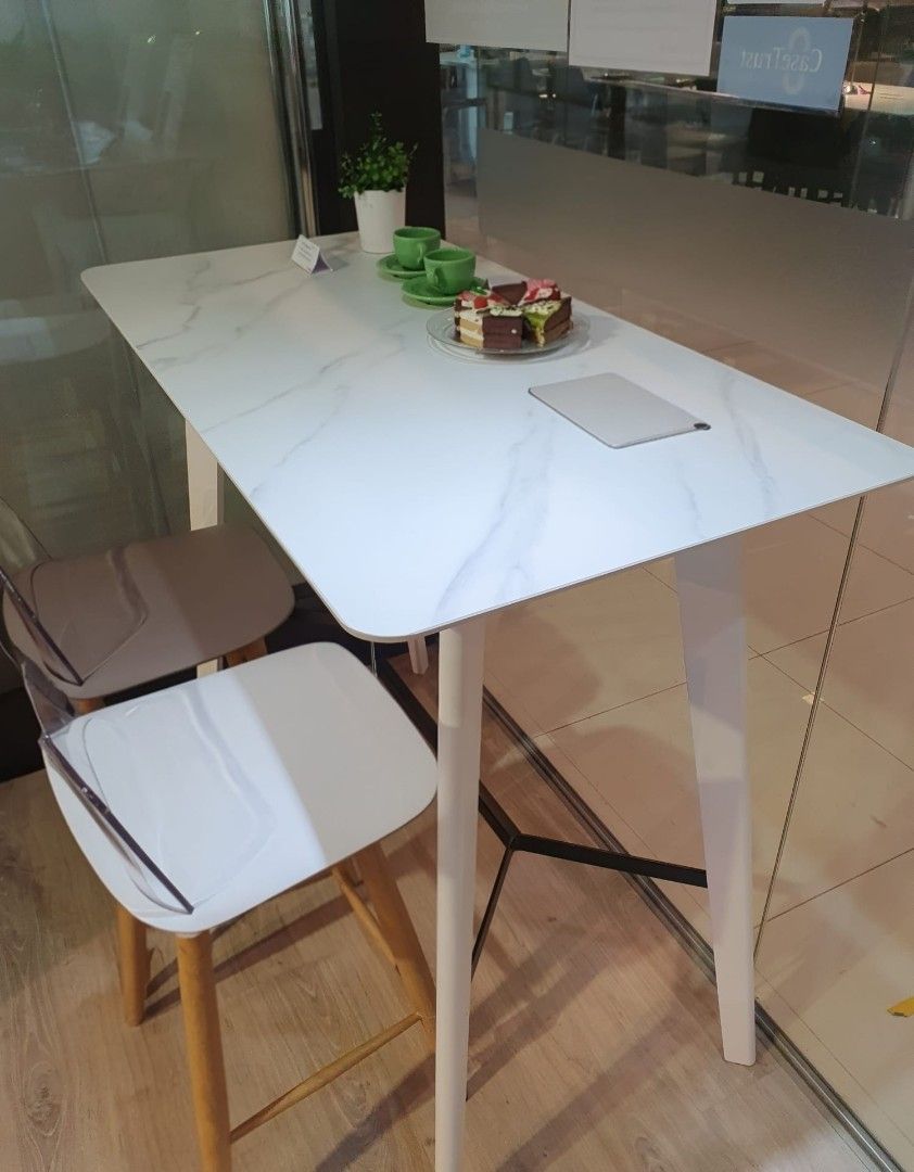 Dining Table (Category: Tables & Sets) located in Singapore. Submitted by fthistle (Listing ID 1377528861, Image 1). Description: White Bar Table with Sintered Stone Top Selling table only. In very good condition. Size: L 1200 x W 600 x H 1020 mm.