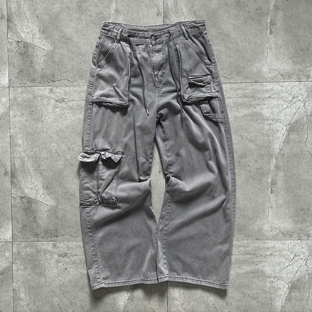 Faded Grey Wide Flared Utility Cargo Pants (Category: Jeans) located in Pasig City. Submitted by deteriortdmaterial (Listing ID 1377509621, Image 1). Description: Faded Grey Wide Flared Utility Cargo Pants Features a drawstring in the waist band Waist: 32 inches Rise: 12.5 inches Inseam: 28 inches Length: 41 inches Hem: 11 inches Price: 1750 + sf DM TO PURCHASE.