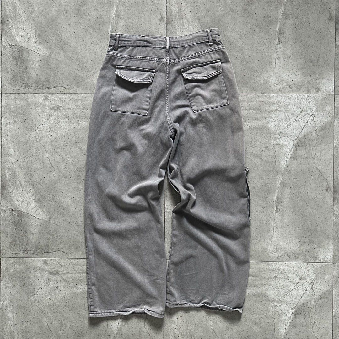 Faded Grey Wide Flared Utility Cargo Pants (Category: Jeans) located in Pasig City. Submitted by deteriortdmaterial (Listing ID 1377509621, Image 3). Description: Faded Grey Wide Flared Utility Cargo Pants Features a drawstring in the waist band Waist: 32 inches Rise: 12.5 inches Inseam: 28 inches Length: 41 inches Hem: 11 inches Price: 1750 + sf DM TO PURCHASE.