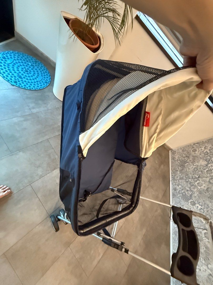 Foldable Pet Stroller. (Category: Homes & Other Pet Accessories) located in Singapore. Submitted by sxxxseansxxx (Listing ID 1377442507, Image 2). Description: This pet stroller is in excellent condition. It features a navy blue and cream canopy, a cup holder, and a storage basket. The stroller is easy to fold and unfold. Perfect for taking your furry friend on walks!.