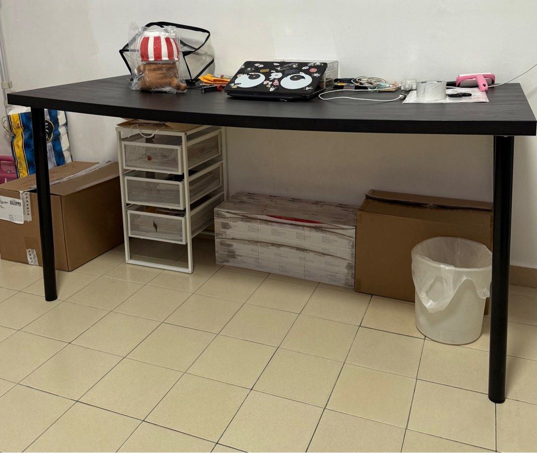 IKEA Table (Category: Tables & Sets) located in Singapore. Submitted by thevanitymart (Listing ID 1377408445, Image 1). Description: IKEA table. Good condition except for the bend in the middle due to weight of items. Self collect at Tampines 150cm x 75cm .