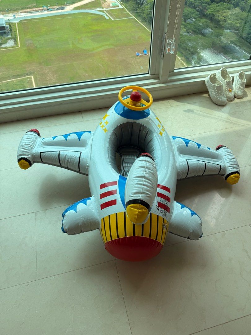 Inflatable Airplane Pool Float (Category: Infant Playtime) located in Singapore. Submitted by antares111 (Listing ID 1377407943, Image 1). Description: Fun inflatable airplane pool float for kids. Features a steering wheel and a comfortable seat. Perfect for pool or beach fun. Easy to inflate and deflate. Great for summer! Comes with horn Buy 2 and get a discount. .