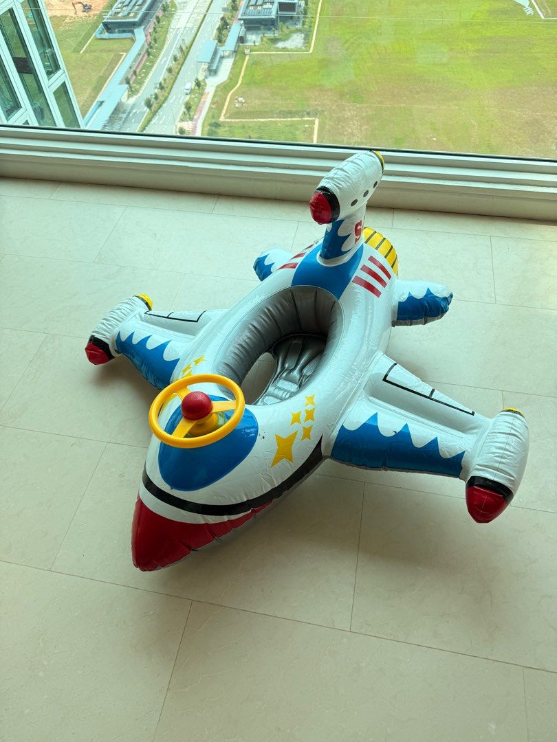 Inflatable Airplane Pool Float (Category: Infant Playtime) located in Singapore. Submitted by antares111 (Listing ID 1377407943, Image 2). Description: Fun inflatable airplane pool float for kids. Features a steering wheel and a comfortable seat. Perfect for pool or beach fun. Easy to inflate and deflate. Great for summer! Comes with horn Buy 2 and get a discount. .