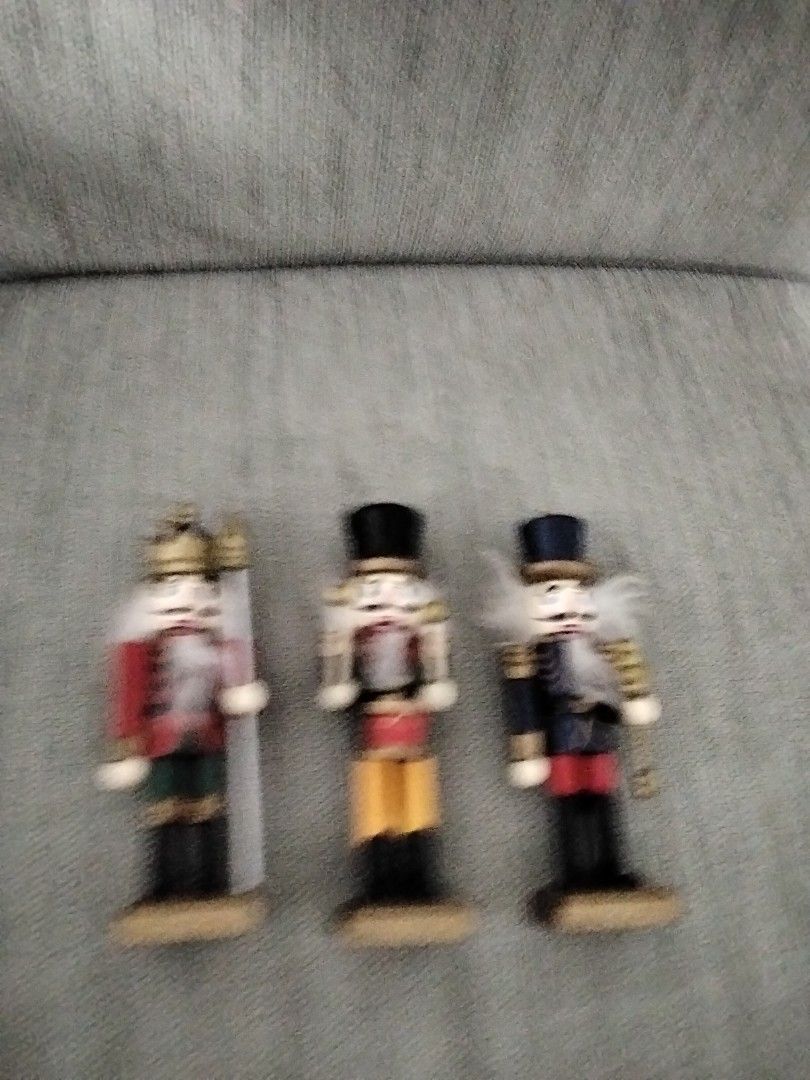 Miniature Nutcracker Figurines - Set of 3 (Category: Toys & Games) located in Singapore. Submitted by Lone.Wolve (Listing ID 1377430317, Image 1). Description: - Set of three miniature nutcracker figurines. - Made of wood. - Each figurine is uniquely painted. - Classic design. - In good condition. - Perfect for display or as a gift..