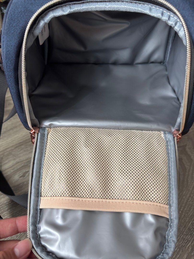 Princeton Cooler bag - Navy Blue with Rose Gold Zippers (Category: Diaper Bags & Wetbags) located in Singapore. Submitted by snowypenguin93 (Listing ID 1377404923, Image 3). Description: Stylish and functional mommy bag in navy blue with rose gold zippers. Features multiple compartments for organization, including a mesh pocket. Includes a top handle and a shoulder strap for easy carrying. Perfect for keeping baby essentials organized on the go. 