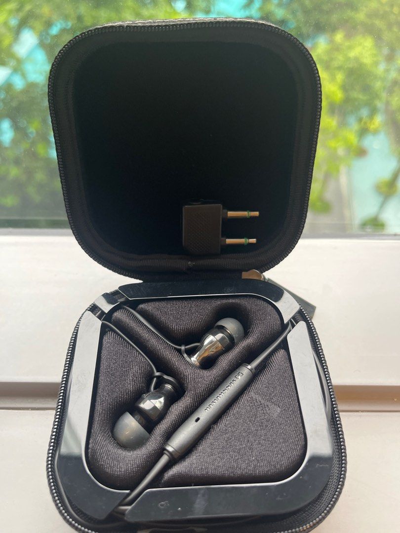 Sennheiser black Earphones with Case (Category: Earphones) located in Singapore. Submitted by poopoomcgee (Listing ID 1377438971, Image 2). Description: Sennheiser earphones in excellent condition, complete with original case. Includes various ear tips and a headphone adapter. The earphones appear to be lightly used and well-maintained. Perfect for music lovers seeking quality sound. Comes with free travel adapter .