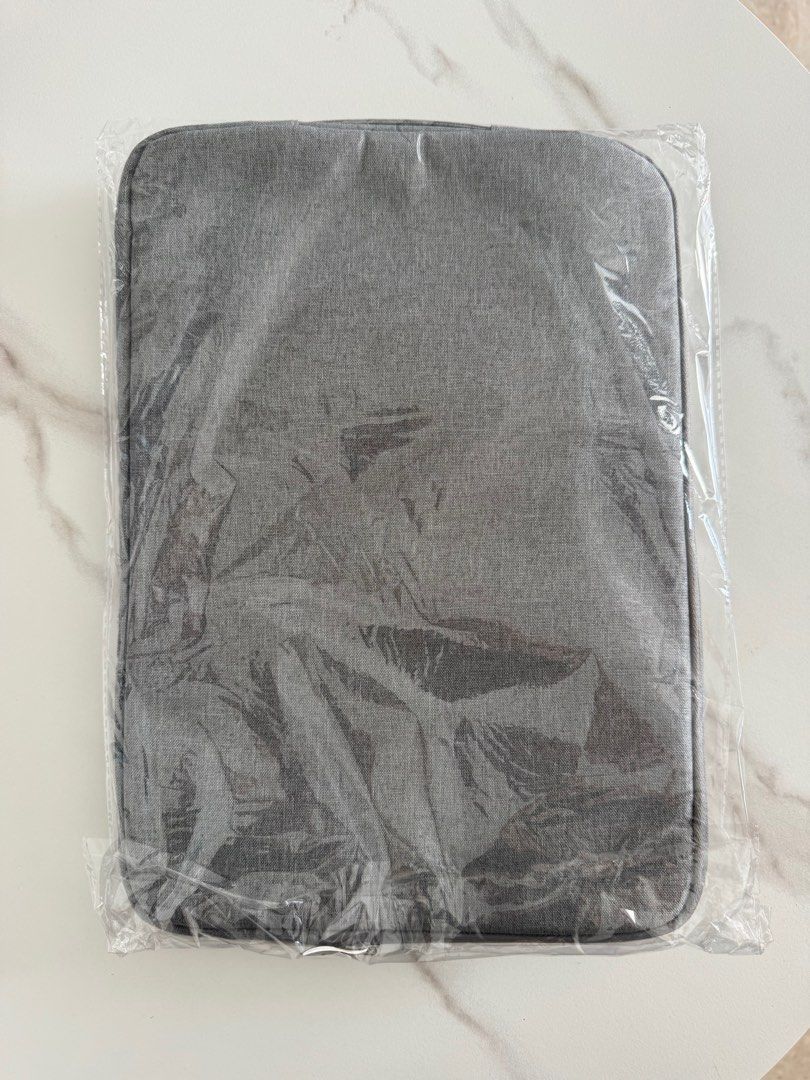 Sony 14" Laptop Sleeve - Brand New (Category: Laptop Bags & Sleeves) located in Singapore. Submitted by puttpp1 (Listing ID 1377386743, Image 2). Description: Brand new Sony laptop sleeve, still in its original packaging. Features a front pocket for accessories. Designed to fit 14-inch laptops. Protect your device in style with this sleek and durable sleeve..