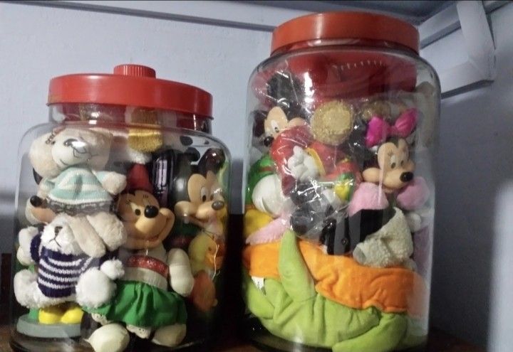 Assorted Stuffed Toys in vintage glass Jars (Category: Toys & Games) located in Singapore. Submitted by pastpassion (Listing ID 1377688314, Image 3). Description: - Assorted collection of stuffed toys. - Includes Mickey Mouse, teddy bears, and other characters. - Toys are stored in vintage glass jars with red lids. -price from $69 onwards.. - Ideal for collectors or decorative use. - Some toys may have minor wear and tear..