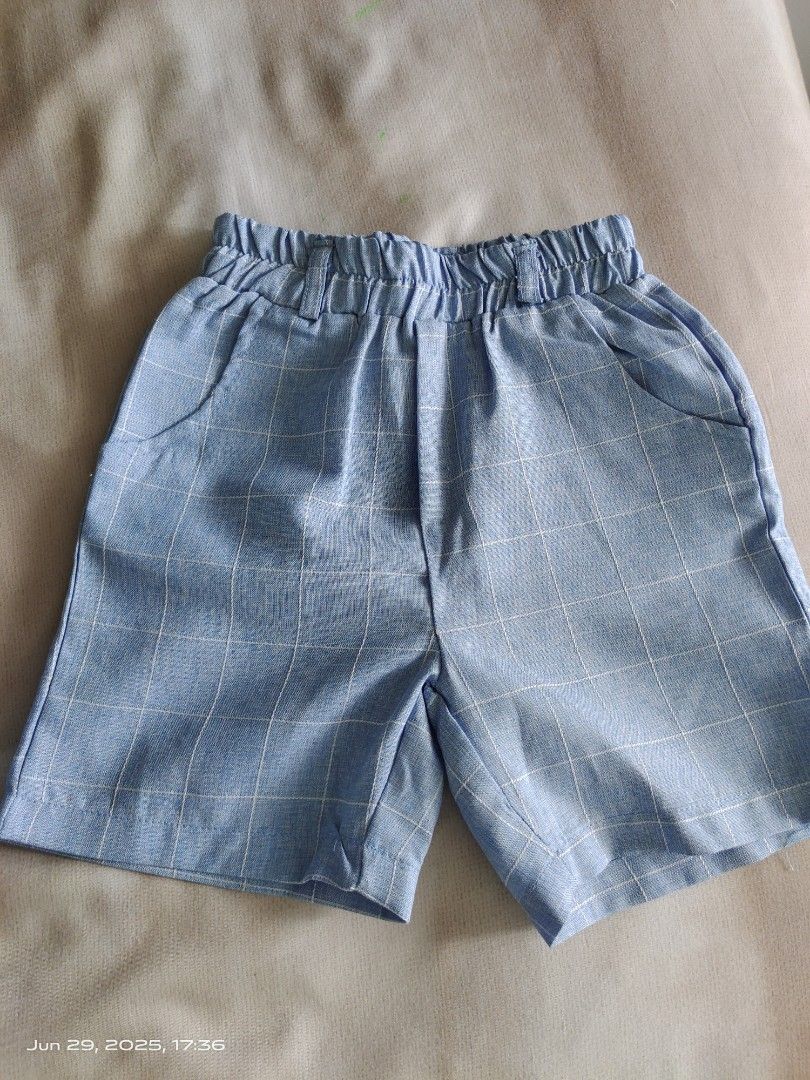 Baby Boy Formal Outfit Set (Category: Babies & Kids Fashion) located in Singapore. Submitted by Boss_Baby (Listing ID 1377657430, Image 2). Description: - Baby boy formal outfit set - Includes: vest, shorts, shirt, and bow tie - Vest and shorts: Light blue plaid - Shirt: White - Excellent condition - Perfect for special occasions and photoshoots.