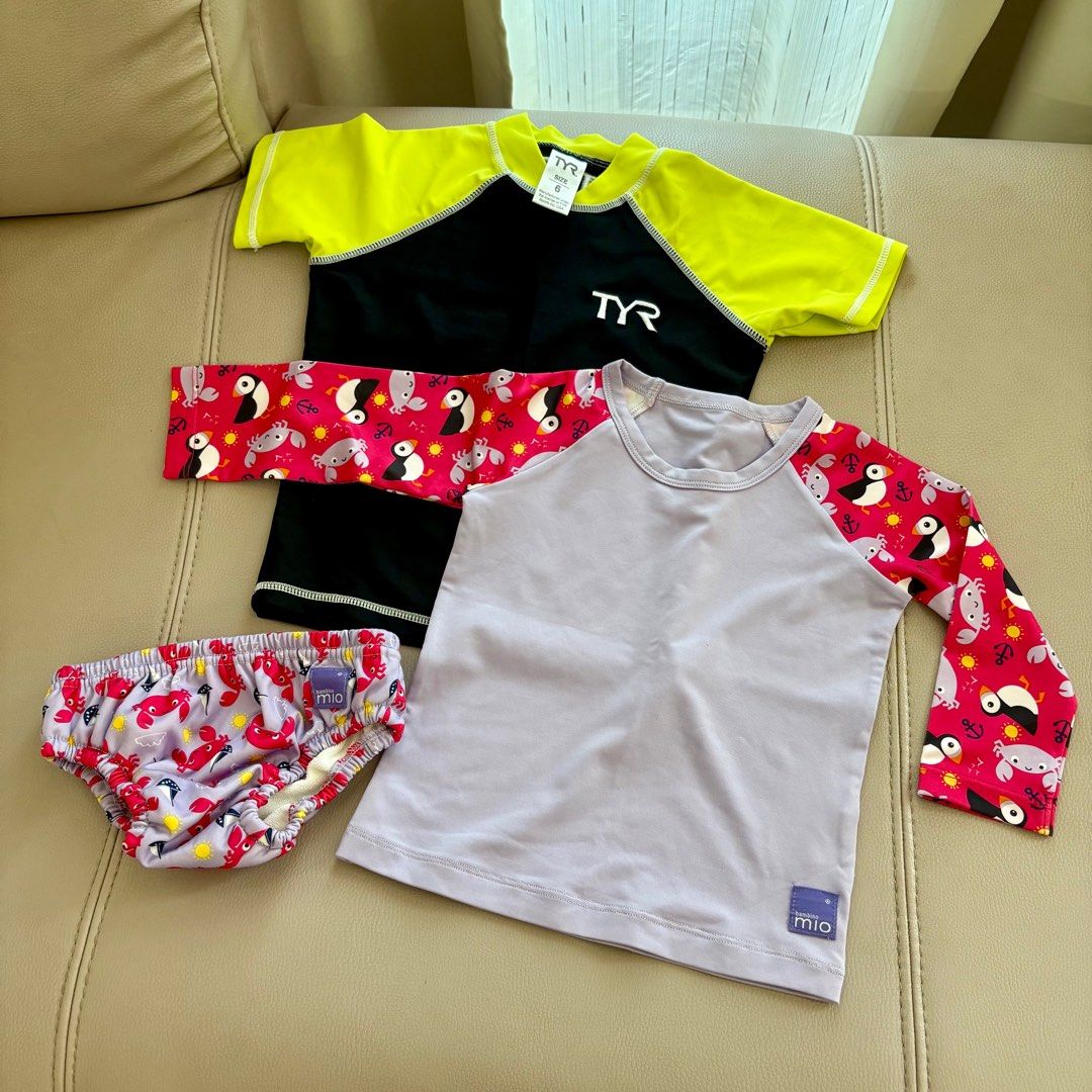 Baby swimwear (Category: Babies & Kids Fashion) located in Singapore. Submitted by emilimini (Listing ID 1377635950, Image 1). Description: Top: Length 34cm, PTP 28cm Label indicates it is suitable for 12-15kg .