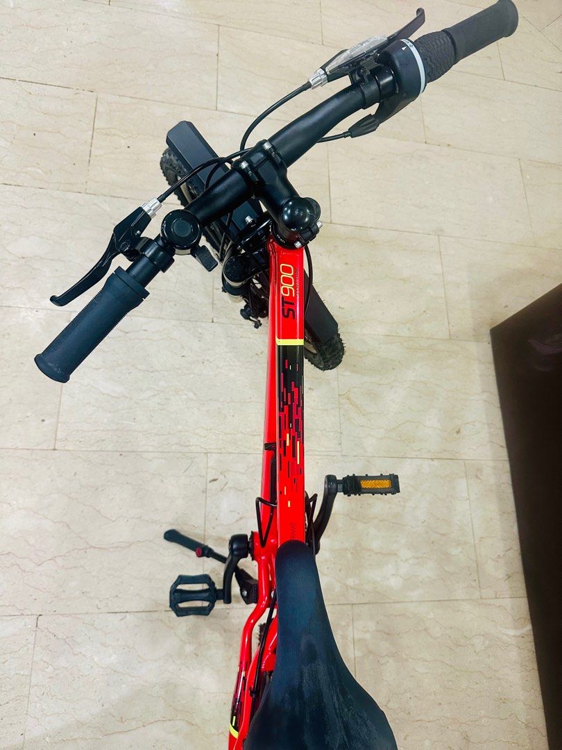 Bicycle (Category: Bicycles) located in Singapore. Submitted by nijardeen (Listing ID 1377679728, Image 1). Description: Decathlon: ST 900 RR 20_QUOTE_ RED CN FR Model has gears and suspension Suitable for primary students age group Rarely used, looks brand new. Accessories: Bike stand Mudguard Cup holder Bell.