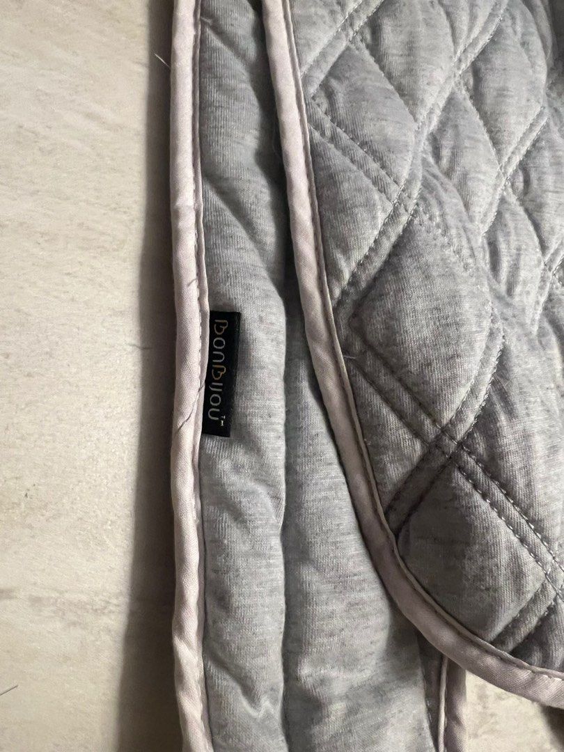 Bonbijou Baby Head Support - Grey (Category: Cots & Cribs) located in Singapore. Submitted by awesomely (Listing ID 1377716709, Image 1). Description: This Bonbijou baby head support is in excellent condition. It's a soft, quilted grey fabric with a light pink trim. The head support is designed to cradle the baby's head and neck. It looks clean and well-maintained. Bonbijou 2 in 1 infant head support for stroller, car seat, rocker, carrier Like N