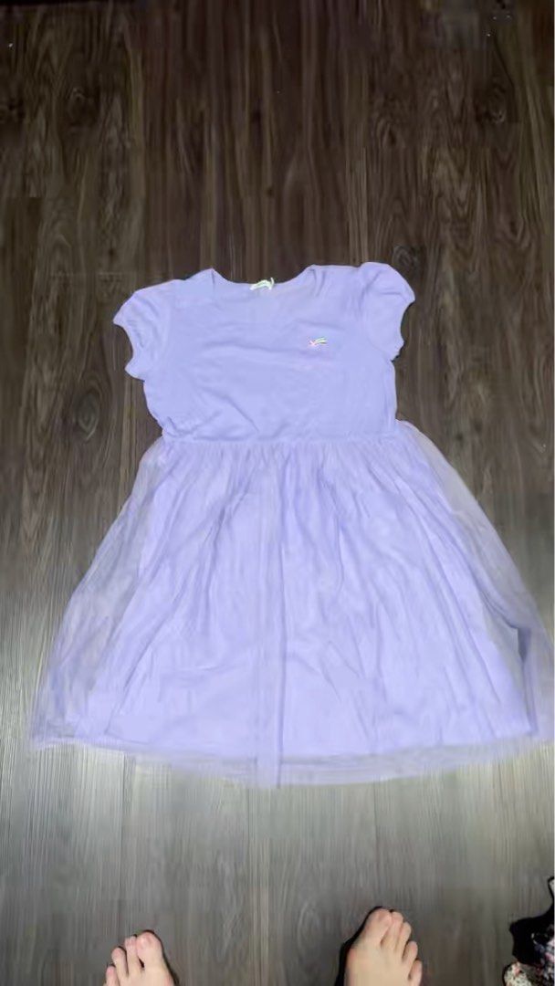 Bossini Purple Dress - Size 160 (Category: Babies & Kids Fashion) located in Singapore. Submitted by allyvivian (Listing ID 1377666173, Image 3). Description: Lovely purple dress from Bossini. Features a tulle skirt and short sleeves. Size 160, suitable for older children or teens. Perfect for parties or everyday wear. In excellent condition..